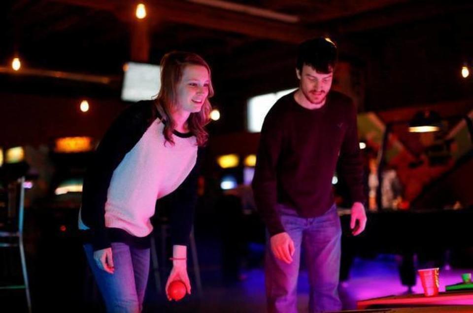 Jacqi Linville and Edward Mily play Skee-Ball at Boxcar Bar + Arcade Wednesday, March 11, 2015 in Raleigh, N.C.