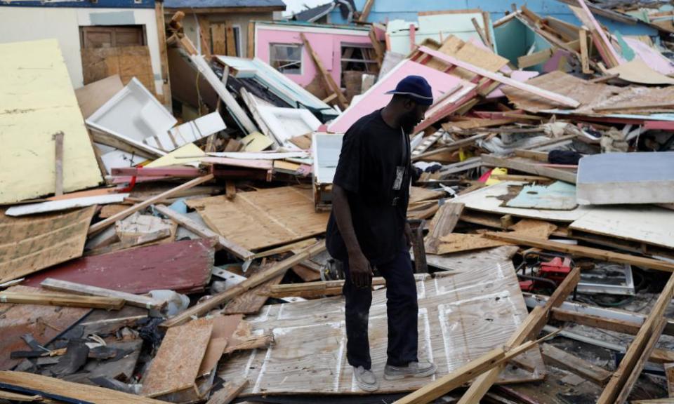 A man looks for valuables things among the debris at The Mud neightborhood.