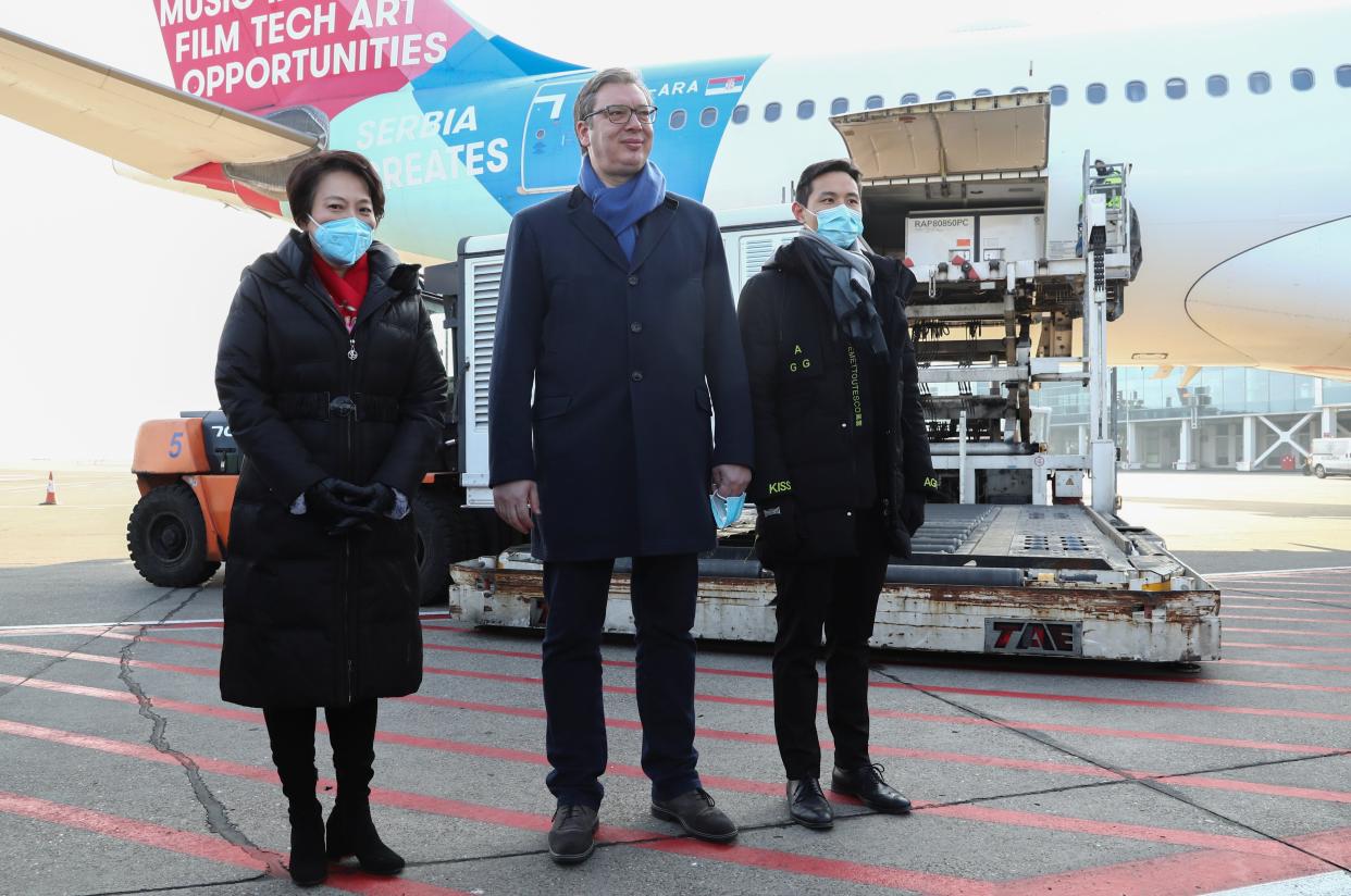 Serbian President Aleksandar Vucic (pictured centre) await the arrival of the Chinese Covid-19 vaccine on Saturday (REUTERS)