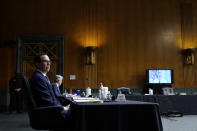 Sen. Jon Tester, D-Mont., speaks via teleconference as Treasury Secretary Steven Mnuchin and Chairman of the Federal Reserve Jerome Powell testify during a Senate Banking Committee hearing on 'The Quarterly CARES Act Report to Congress' on Capitol Hill in Washington, Tuesday, Dec. 1, 2020. (AP Photo/Susan Walsh, Pool)