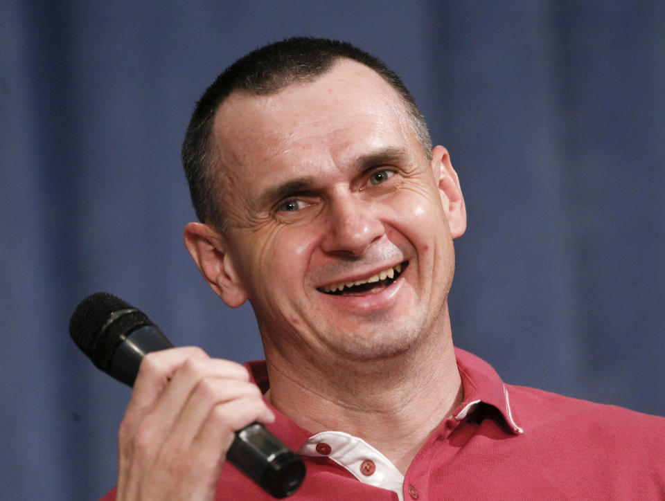 Ukrainian filmmaker Oleg Sentsov, former Russian prisoner, smiles during his press conference in Kyiv, Ukraine, Tuesday, Sept. 10, 2019. After five years of being locked up in a Russian prison Sentsov was one of the 35 freed Ukrainian prisoners. (AP Photo/Efrem Lukatsky)