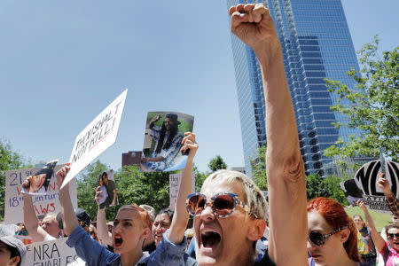 Gun control demonstrators protest outside of the annual National Rifle Association (NRA) convention in Dallas, Texas, U.S., May 5, 2018. REUTERS/Lucas Jackson