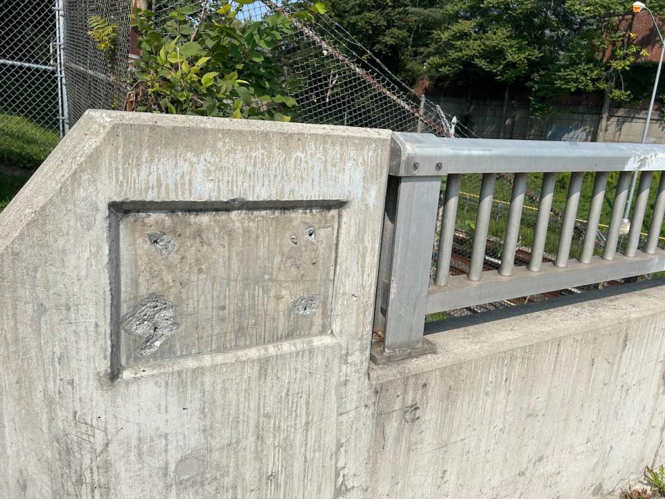 An empty inlaid space for a commemorative plaque that's been illegally removed, just off Yonge Street over the subway line in midtown.