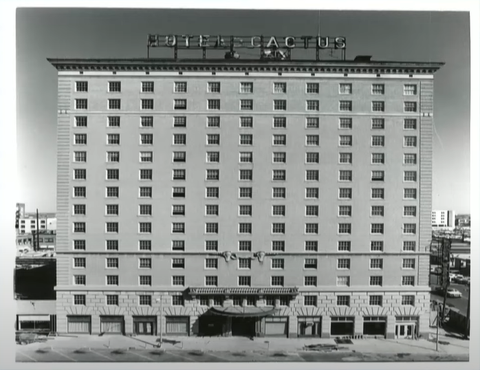 An image of the Cactus Hotel taken in 1984, when awnings were temporarily removed from the building for a major renovation.