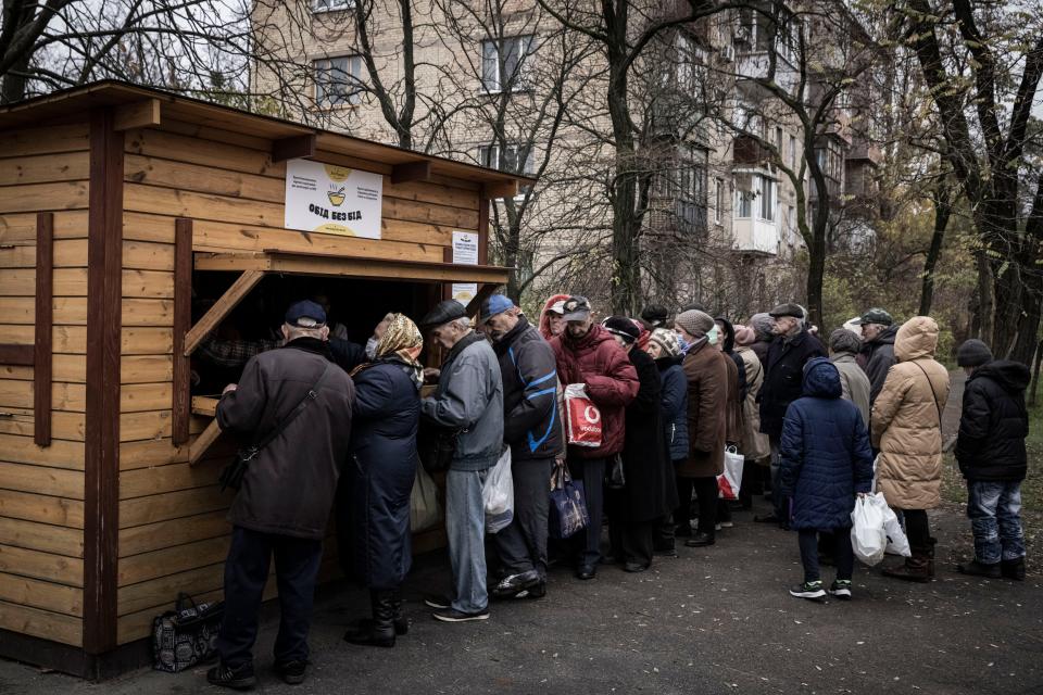 Pensioners queue up for free soup, bread and hot food handed out at a stand run by a charity called Enjoying Life on November 07, 2022 in Kyiv, Ukraine. Electricity and heating outages across Ukraine caused by missile and drone strikes to energy infrastructure have added urgency to preparations for winter.