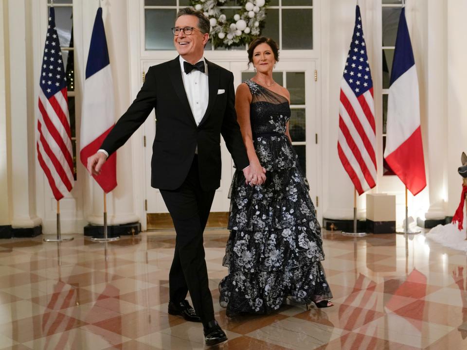 Late night talk show host Stephen Colbert and his wife Evelyn McGee-Colbert arrive for the State Dinner with President Joe Biden and French President Emmanuel Macron at the White House in Washington, Thursday, Dec. 1, 2022.