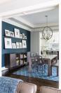 <p>In a breakfast room from <a href="https://deringhall.com/interior-designers/celia-welch-interiors" rel="nofollow noopener" target="_blank" data-ylk="slk:Celia Welch Interiors;elm:context_link;itc:0;sec:content-canvas" class="link ">Celia Welch Interiors</a>, a blue wall ties together the colors of the space.</p>