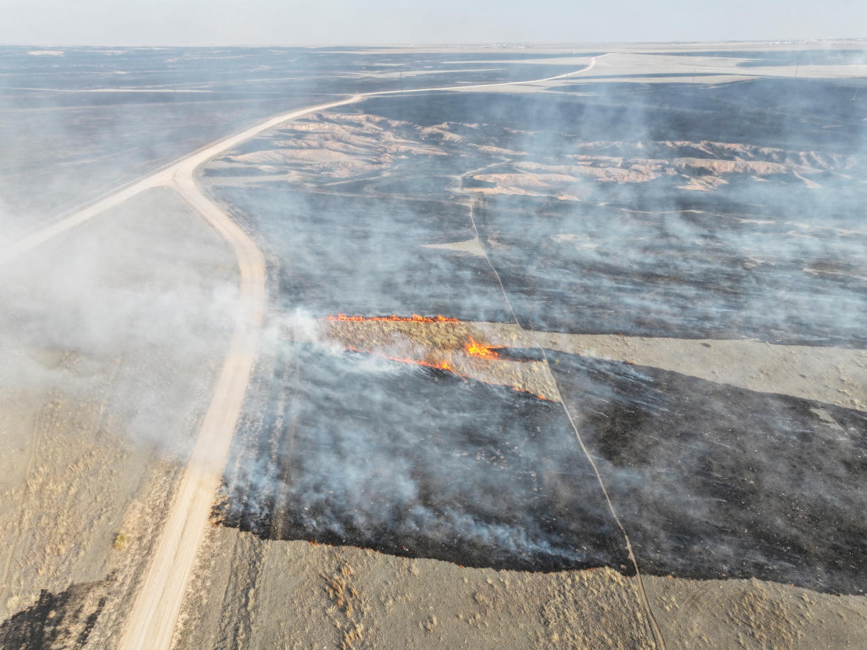 An aerial view of grasslands burning from the Smokehouse Creek Fire in Roberts County on Wednesday.