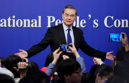 China's Foreign Minister Wang Yi speaks to the media after a news conference during the National People's Congress (NPC), China's parliamentary body, in Beijing, China March 8, 2018. REUTERS/Jason Lee