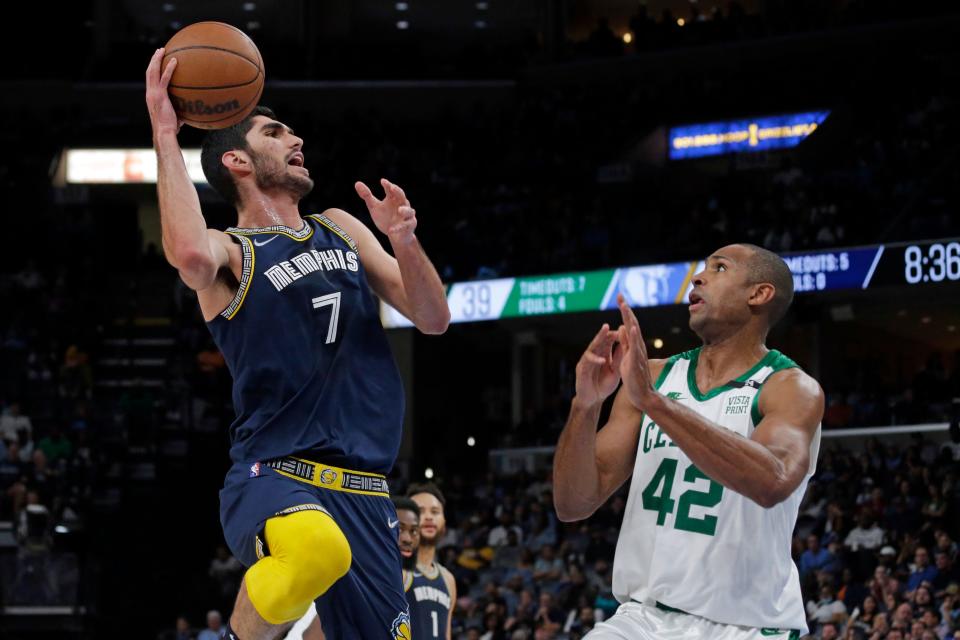 Apr 10, 2022; Memphis, Tennessee, USA; Memphis Grizzlies forward Santi Aldama (7) shoots as Boston Celtics center Al Horford (42) defends during the first half at FedExForum. Mandatory Credit: Petre Thomas-USA TODAY Sports