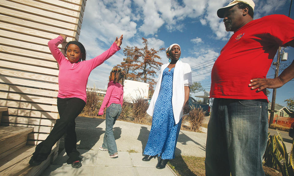 Lower Ninth resident Robert Green and his family outside of their Make It Right home in 2009, soon after construction was completed.