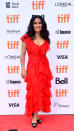 <p>Hayek wowed audiences in a bright red layered dress by Alexander McQueen at the premiere of her film, “The Hummingbird Project.” </p>