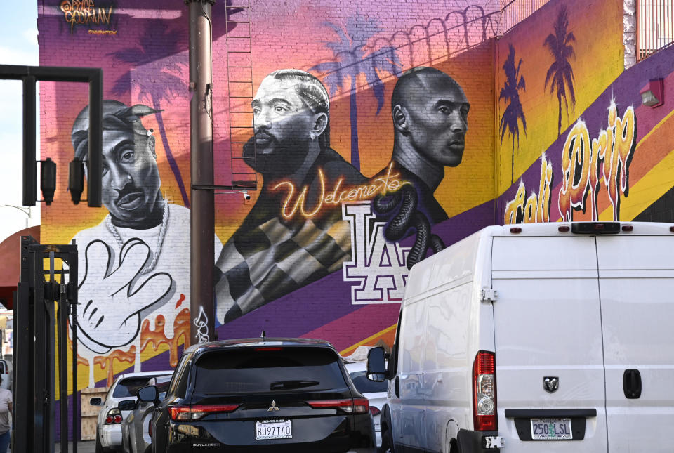 A mural of Tupac Shakur, Nipsey Hussle and Kobe Bryant by Price Goodman and Myinkflow is seen on the second anniversary of Bryant's death on January 26, 2022 in Los Angeles,  California.  / Credit: Getty Images