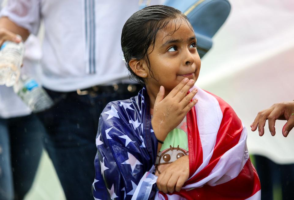 Hossana Faith Pozos, 6, of Vero Beach, watches as demonstrators gather in Riverside Park in Vero Beach on Thursday, June 1, 2023, in response to Senate Bill 1718, which was signed into law by Gov. Ron DeSantis. The law takes effect July 1. Vero Beach was one of six cities statewide, including Fort Pierce, where opponents to Florida's new immigration law held rallies Thursday. The law impacts immigrants' employment, health care and the process of obtaining identification documents.