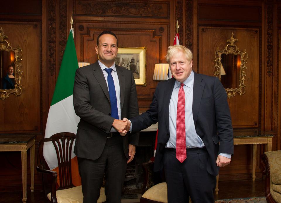 Ireland's Taoiseach, prime minister, Leo Varadkar (L) and Britain's Prime Minister Boris Johnson (R) pose for a photograph inside Thornton Manor Hotel, near Birkenhead, north-west England on October 10, 2019, as they meet for Brexit talks. - British Prime Minister Boris Johnson will meet his Irish counterpart for last-ditch Brexit talks on Thursday, with just days left to strike an EU divorce deal and both sides blaming each other for the impasse. Johnson will sit down with Irish Prime Minister Leo Varadkar at an undisclosed location in northwest England following several days of recriminations over the failure to find an acceptable compromise. (Photo by Noel Mullen / POOL / AFP) (Photo by NOEL MULLEN/POOL/AFP via Getty Images)