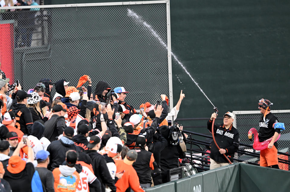 Orioles owner David Rubenstein sprays fans in the Splash Zone during the second inning Friday at Camden Yards. (Photo by G Fiume/Getty Images)