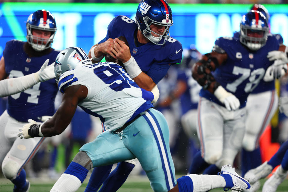 New York Giants quarterback Daniel Jones (8) is sacked by Dallas Cowboys defensive end DeMarcus Lawrence (90) during the first half at MetLife Stadium. Mandatory Credit: Ed Mulholland-USA TODAY Sports