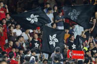 Hong Kong soccer fans wave black version of the Hong Kong flags to protest against government during the FIFA World Cup Qatar 2022 and AFC Asian Cup 2023 Preliminary Joint Qualification Round 2 soccer match between Hong Kong and Iran, in Hong Kong, Tuesday, Sept. 10, 2019. The crowd broke out into "Glory to Hong Kong," a song reflecting their campaign for more democratic freedoms in the semi-autonomous Chinese territory. (AP Photo/Kin Cheung)