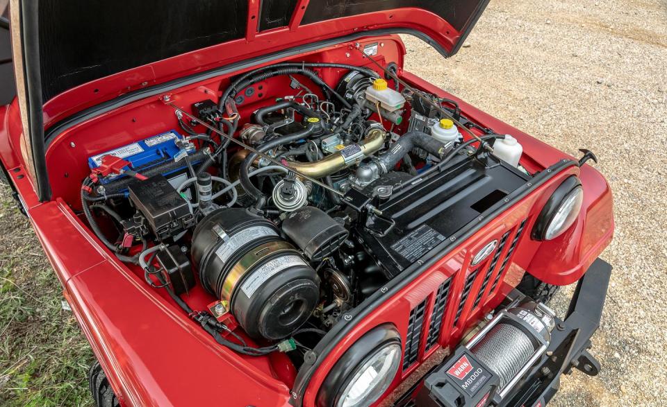 <p>Beneath the hood is Mahindra's turbo-diesel pushrod 2.5-liter inline-four engine. A tiny turbo feeds the manifold 8.0 psi of boost to help generate 62 horsepower and 144 pound-feet of torque.</p>