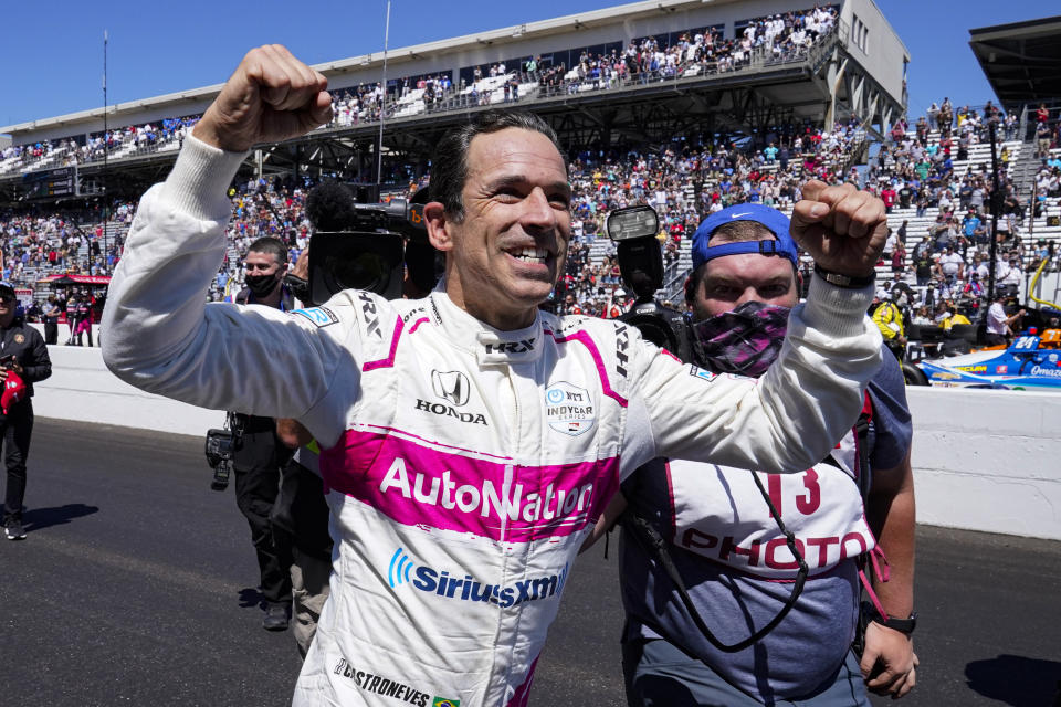 Helio Castroneves of Brazil celebrates after winning the Indianapolis 500 auto race at Indianapolis Motor Speedway in Indianapolis, Monday, May 31, 2021. (AP Photo/Paul Sancya)