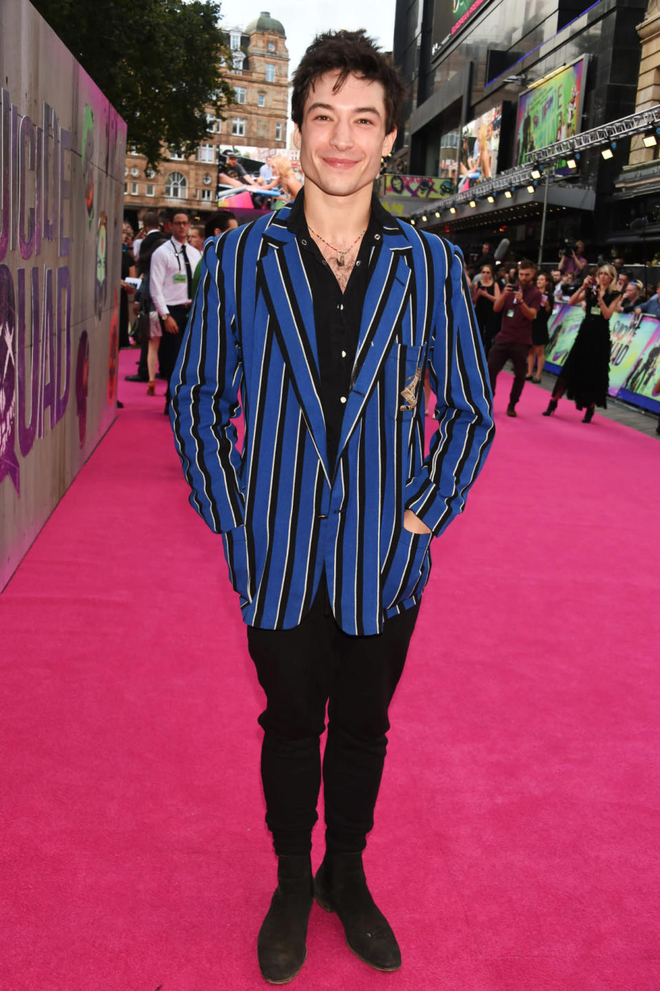 Ezra Miller in a royal blue and black blazer 