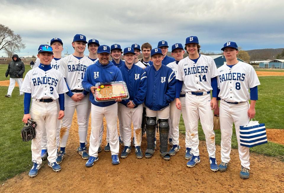 Horseheads head coach Jeff Limoncelli with Blue Raiders players after Limoncelli reached 400 career wins as the school's varsity baseball coach in a 17-1 win over Binghamton on May 26, 2024 at Horseheads High School.