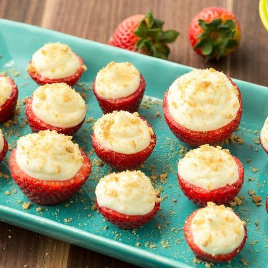 <p>This fun and fruity dessert is the perfect no-bake treat.</p><p>Get the <a href="https://www.delish.com/uk/cooking/recipes/a34793718/cheesecake-stuffed-strawberries-dessert-recipe/" rel="nofollow noopener" target="_blank" data-ylk="slk:Cheesecake-Stuffed Strawberries;elm:context_link;itc:0;sec:content-canvas" class="link ">Cheesecake-Stuffed Strawberries</a> recipe.</p>