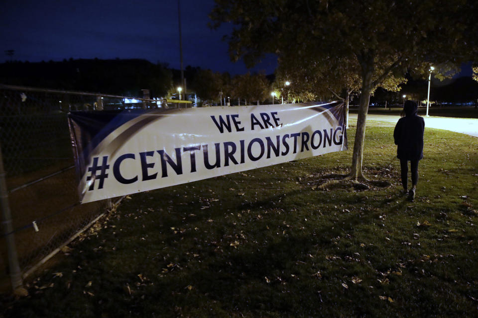 A sign reads #centurionstrong during a vigil at Central Park in the aftermath of a shooting at Saugus High School Thursday, Nov. 14, 2019, in Santa Clarita, Calif. Los Angeles County sheriff’s officials say a 16-year-old student shot several classmates and then himself in a quad area of Saugus High School Thursday morning. (AP Photo/Marcio Jose Sanchez)