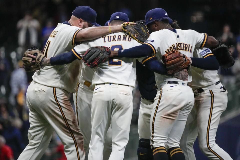 Milwaukee Brewers celebrate after a baseball game against the St. Louis Cardinals Wednesday, Sept. 27, 2023, in Milwaukee. The Brewers won 3-2. (AP Photo/Morry Gash)