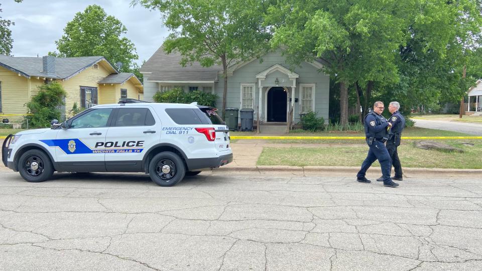 Police work the scene of a homicide on Brown Street in central Wichita Falls.