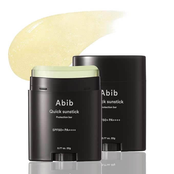 A black Abib container of Quick Sunstick Protection Bar SPF 50+