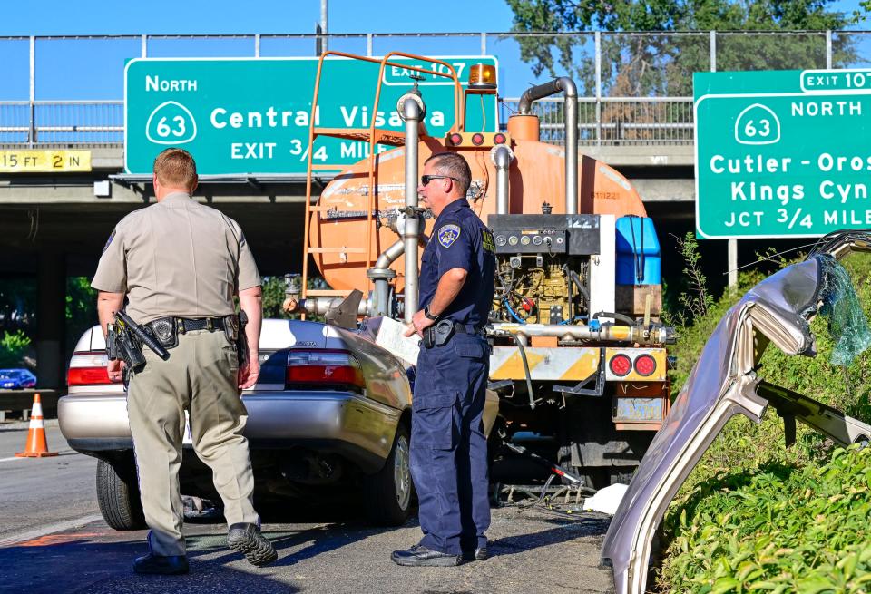 Emergency crews work a collision that killed a woman Tuesday, June 28 on highway 198 just before 4 p.m. The Toyota Corolla she was driving collided with the rear of a parked water truck operated by Cal Trans.