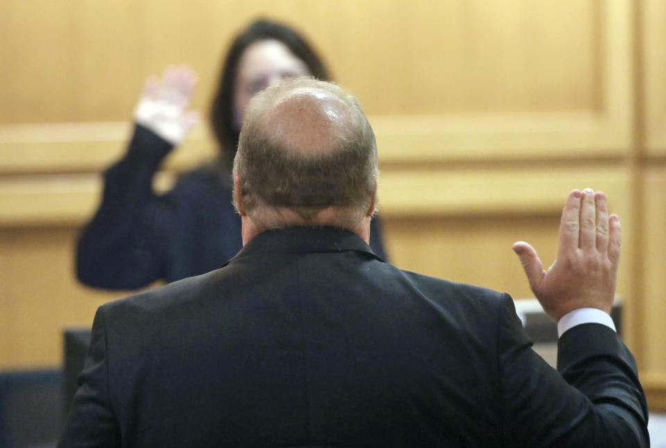 Former Wisconsin Supreme Court Justice Michael Gableman, an investigator hired by Republicans to look into former President Donald Trump's 2020 loss in the battleground state, is sworn in before taking the stand, Friday, June 10, 2022, at the Dane County Courthouse in Madison, Wis. Gableman was found in contempt after he berated the judge and refused to answer any questions on the witness stand. (Amber Arnold/Wisconsin State Journal via AP)