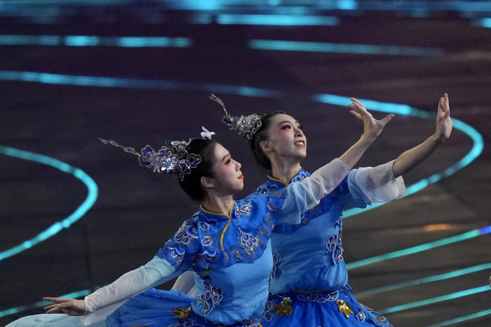 Artists perform ahead of the opening ceremony of the 19th Asian Games in Hangzhou, China, Saturday, Sept. 22, 2023. (AP Photo/Dita Alangkara)