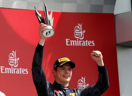 Britain Formula One - F1 - British Grand Prix 2016 - Silverstone, England - 10/7/16 Reb Bull's Max Verstappen celebrates with the trophy after finishing third REUTERS/Andrew Boyers Livepic EDITORIAL USE ONLY.