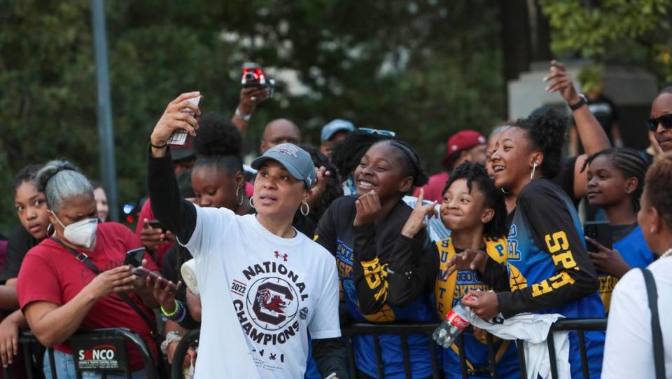 Dawn Staley poses for photographs with fans on Wednesday, April 13, 2022, during a celebration honoring the USC women’s basketball team for winning its second national championship.