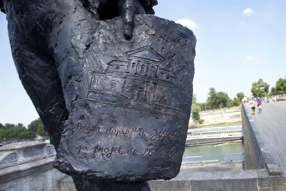 In this photo taken Friday, July 19, 2013, a section of the Thomas Jefferson statue in Paris shows a drawing of the first project to build Monticello house located just outside Charlottesville, Va. (AP Photo/Francois Mori)