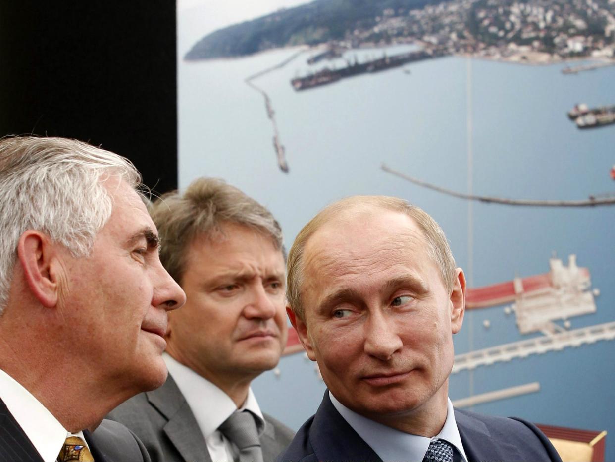 Russia's President Vladimir Putin (R) and ExxonMobil Chairman and CEO Rex Tillerson (L) attend at the ceremony of the signing of an agreement between state-controlled Russian oil company Rosneft and ExxonMobil in June 2012: MIKHAIL KLIMENTYEV/AFP/Getty Images