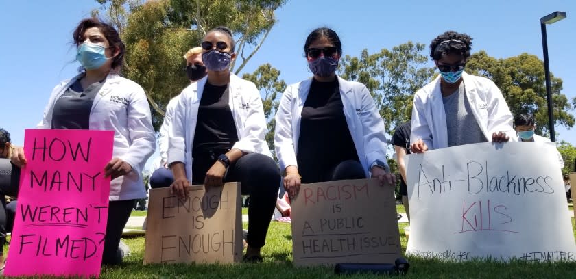 Scores of UC San Diego medical students and others rallied on the La Jolla campus Monday to speak out against racism.