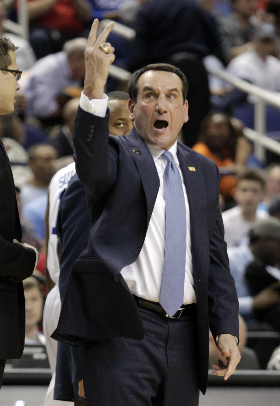 Duke head coach Mike Krzyzewski reacts to a call at the end of the first half of a quarterfinal NCAA college basketball game against Clemson at the Atlantic Coast Conference tournament in Greensboro, N.C., Friday, March 14, 2014. (AP Photo/Bob Leverone)
