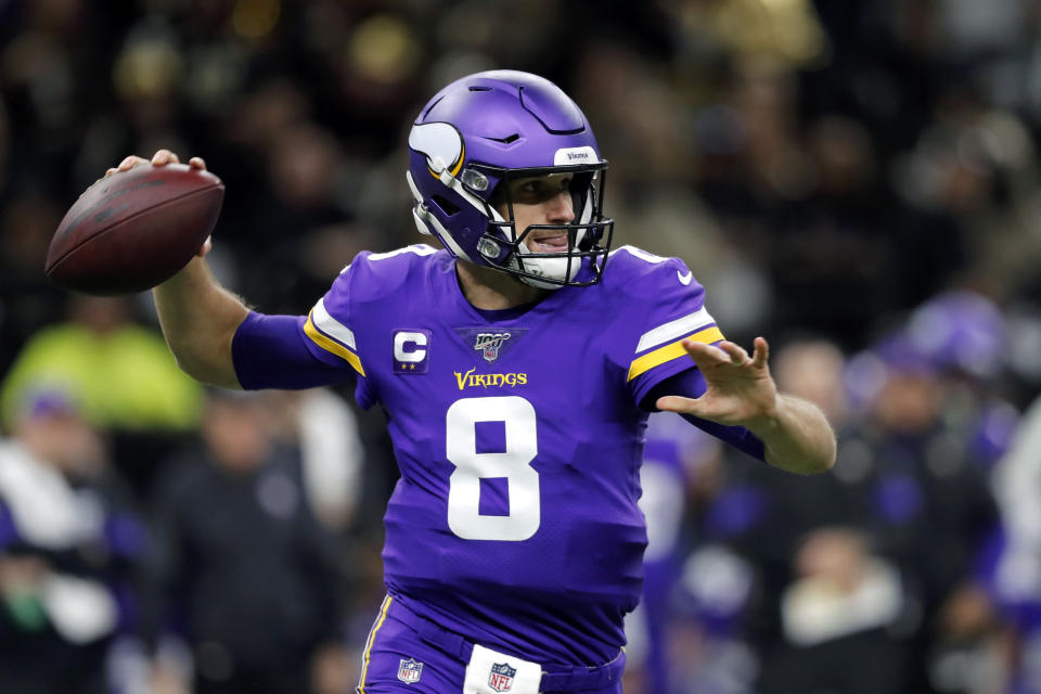 Minnesota Vikings quarterback Kirk Cousins (8) drops back to pass as he throws a pass that was fumbled and recovered by the New Orleans Saints in the first half of an NFL wild-card playoff football game, Sunday, Jan. 5, 2020, in New Orleans. (AP Photo/Gerald Herbert)