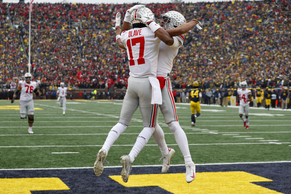 Ohio State wide receiver Chris Olave (17) and Garrett Wilson should be celebrating a lot more next season. (AP Photo/Paul Sancya)