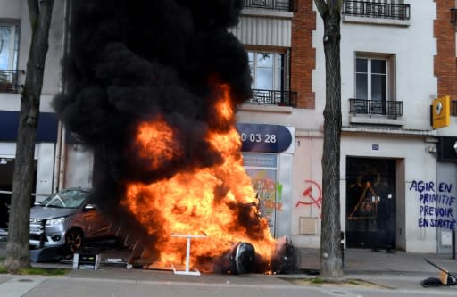 The anti-capitalist protesters torched a McDonald's restaurant and several cars