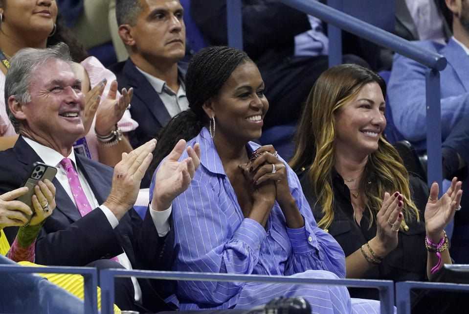 Michelle Obama, second from right, reacts while watching the semifinal match between Frances Tiafoe, of the United States, and Carlos Alcaraz, of Spain, with Jill McCormick, right, at the U.S. Open tennis championships, Friday, Sept. 9, 2022, in New York. (AP Photo/John Minchillo)