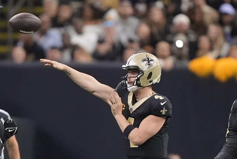 New Orleans Saints quarterback Derek Carr (4) makes a pass in the first half of an NFL football game against the Atlanta Falcons in New Orleans, Sunday, Jan. 7, 2024. (AP Photo/Gerald Herbert)