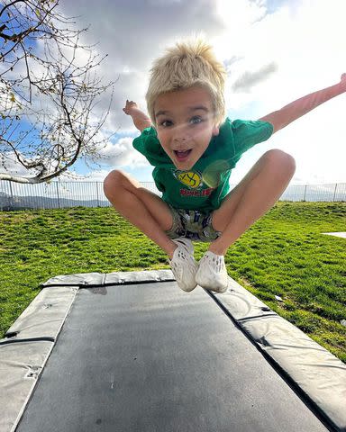 <p>Kourtney Kardashian/Instagram</p> Reign Disick jumping on trampoline