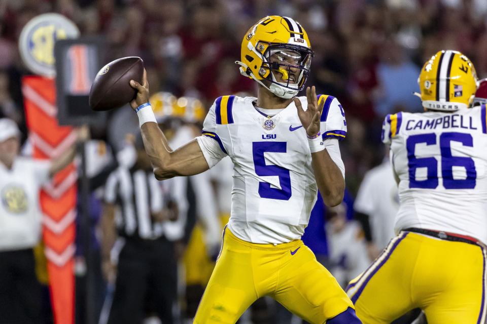 LSU quarterback Jayden Daniels (5) throws the ball against Alabama during the first half of an NCAA college football game, Saturday, Nov. 4, 2023, in Tuscaloosa, Ala. (AP Photo/Vasha Hunt)