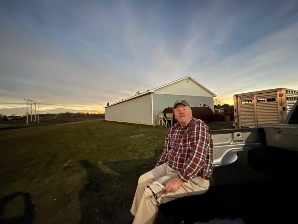 Bill Rowell, owner of Green Mountain Dairy, in Sheldon, Vermont, marvels at the weirdness as darkness descends during the solar eclipse on April 8, 2024.