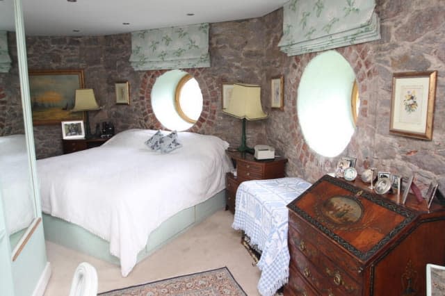 One of the bedrooms, with a circular window.