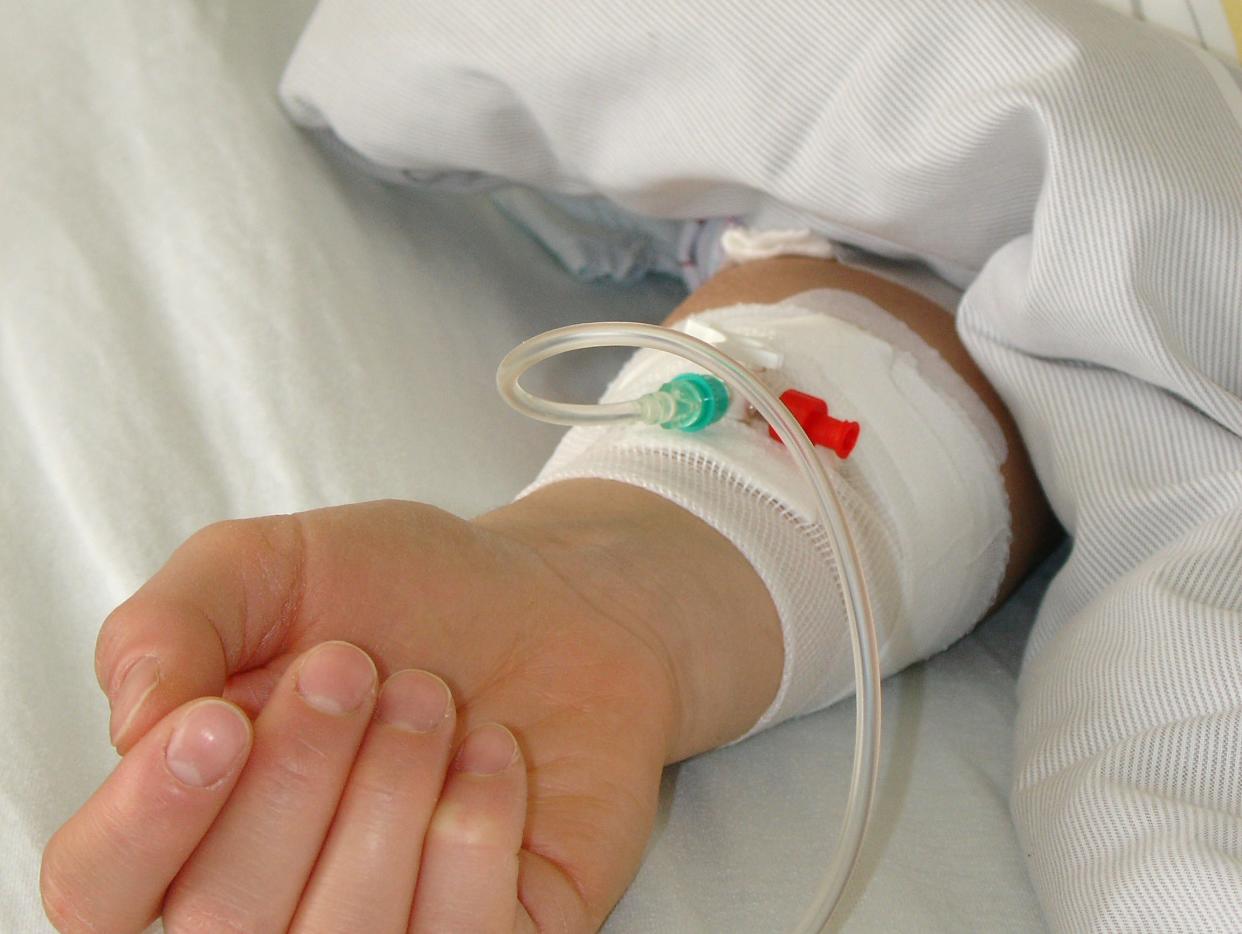 child hand in hospital